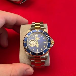 2. Invicta no tick- automatic move open back watch